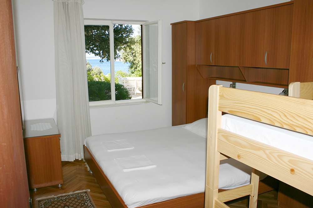 Bedroom in Apartment S1-A with double bed and wardrobe