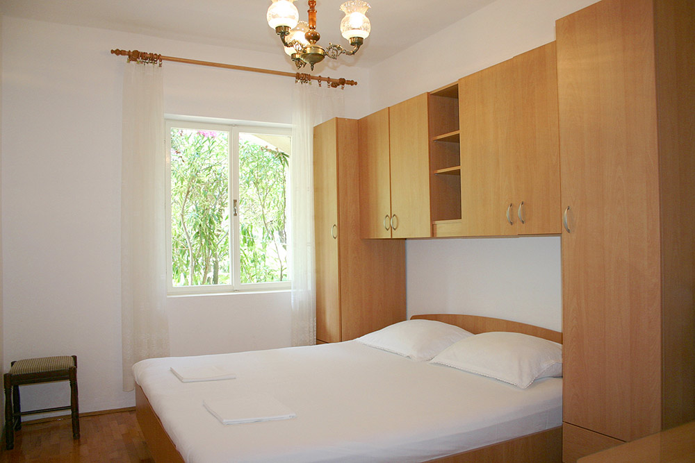 Bedroom in Apartment S1-B with double bed and wardrobe