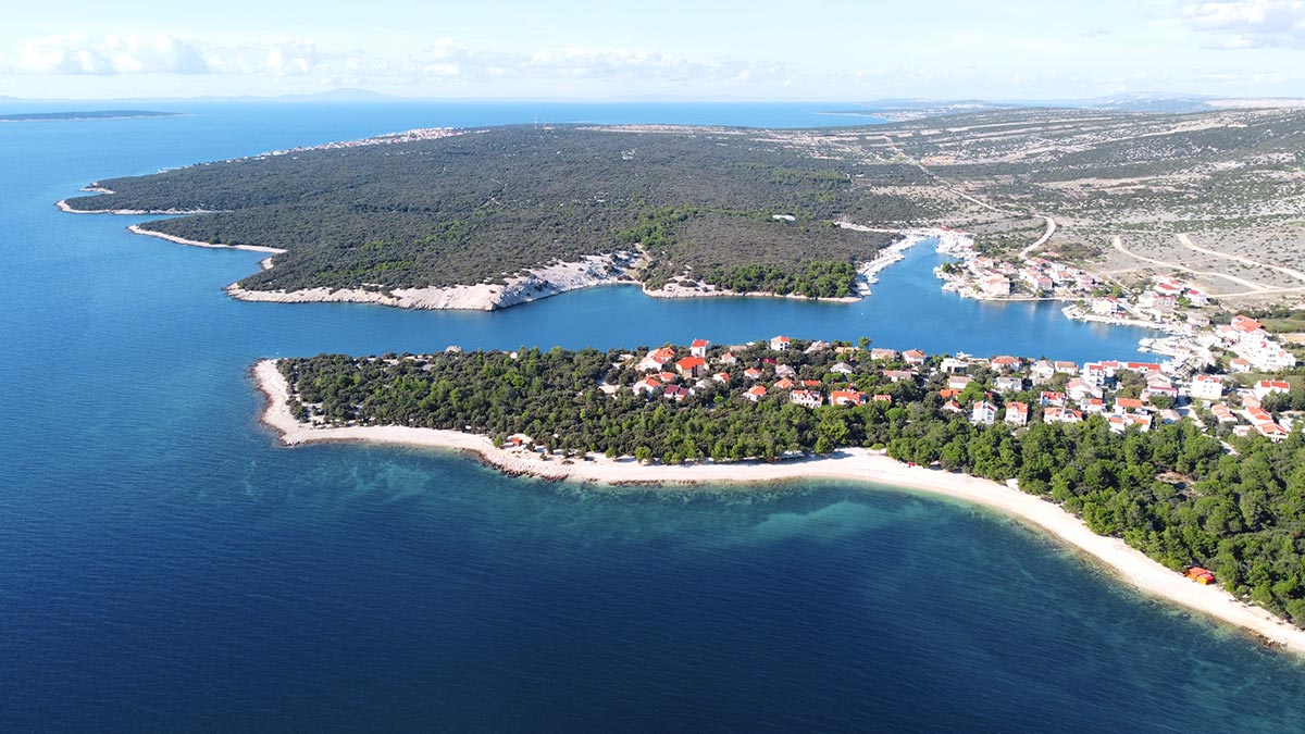 Air view of Šimuni bay on Pag Island